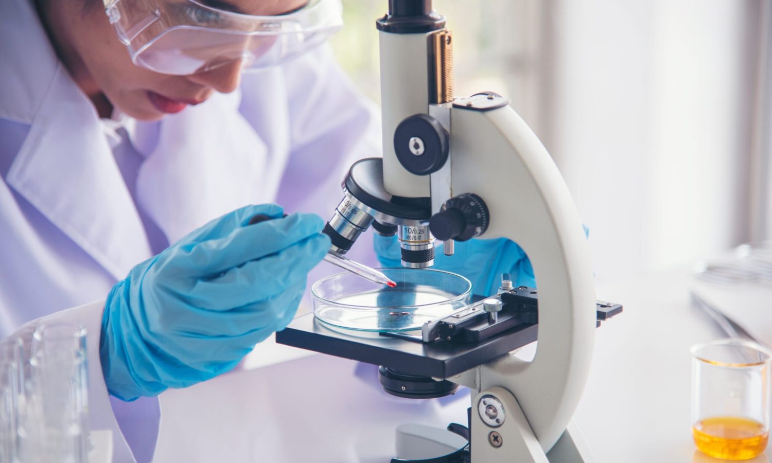 Woman scientist in lab look at science microscope medical test and research biology chemistry. Females technician laboratory analyzing scientific pharmacy genetic research. Chemistry Medical test lab