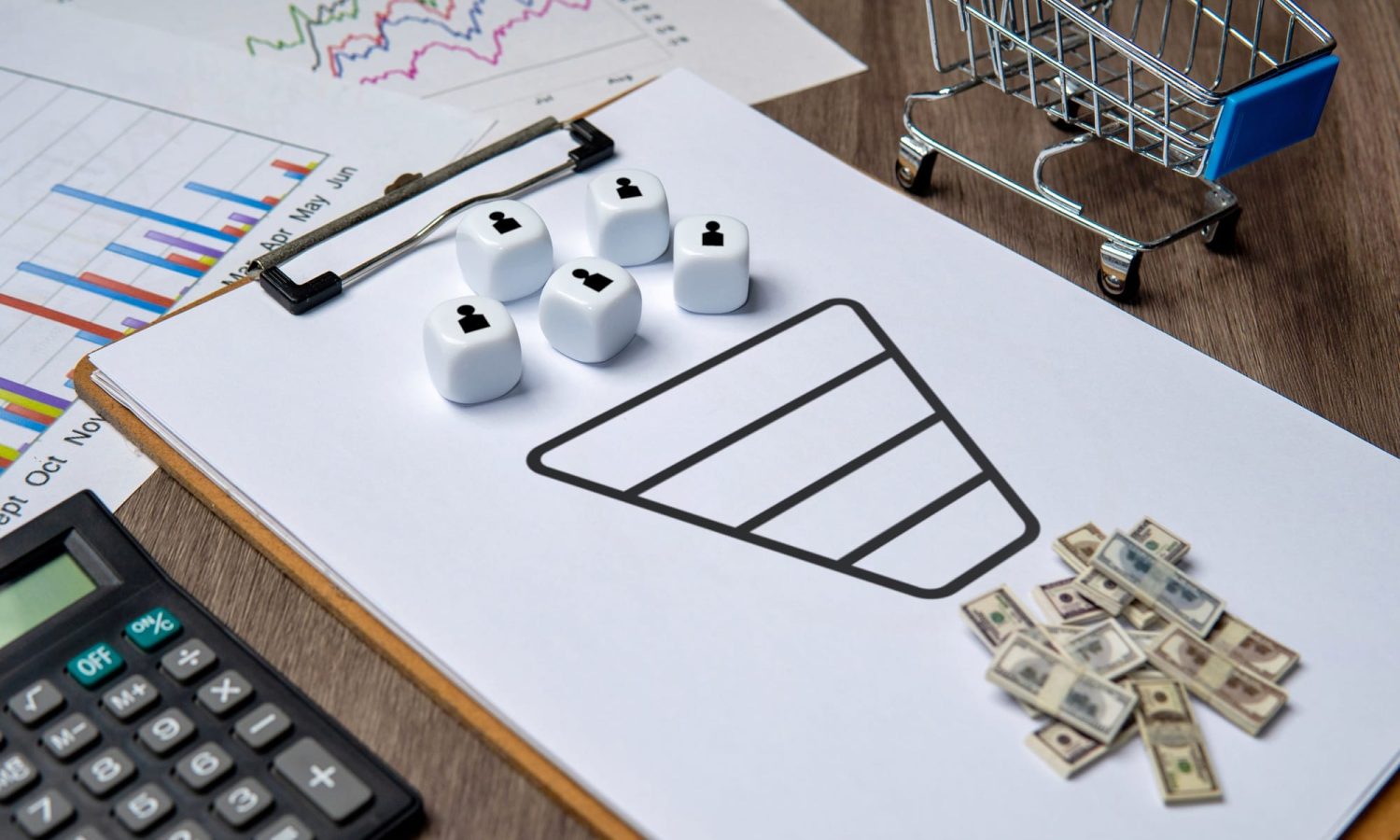 A clipboard with a sales funnel diagram and dice representing customers.