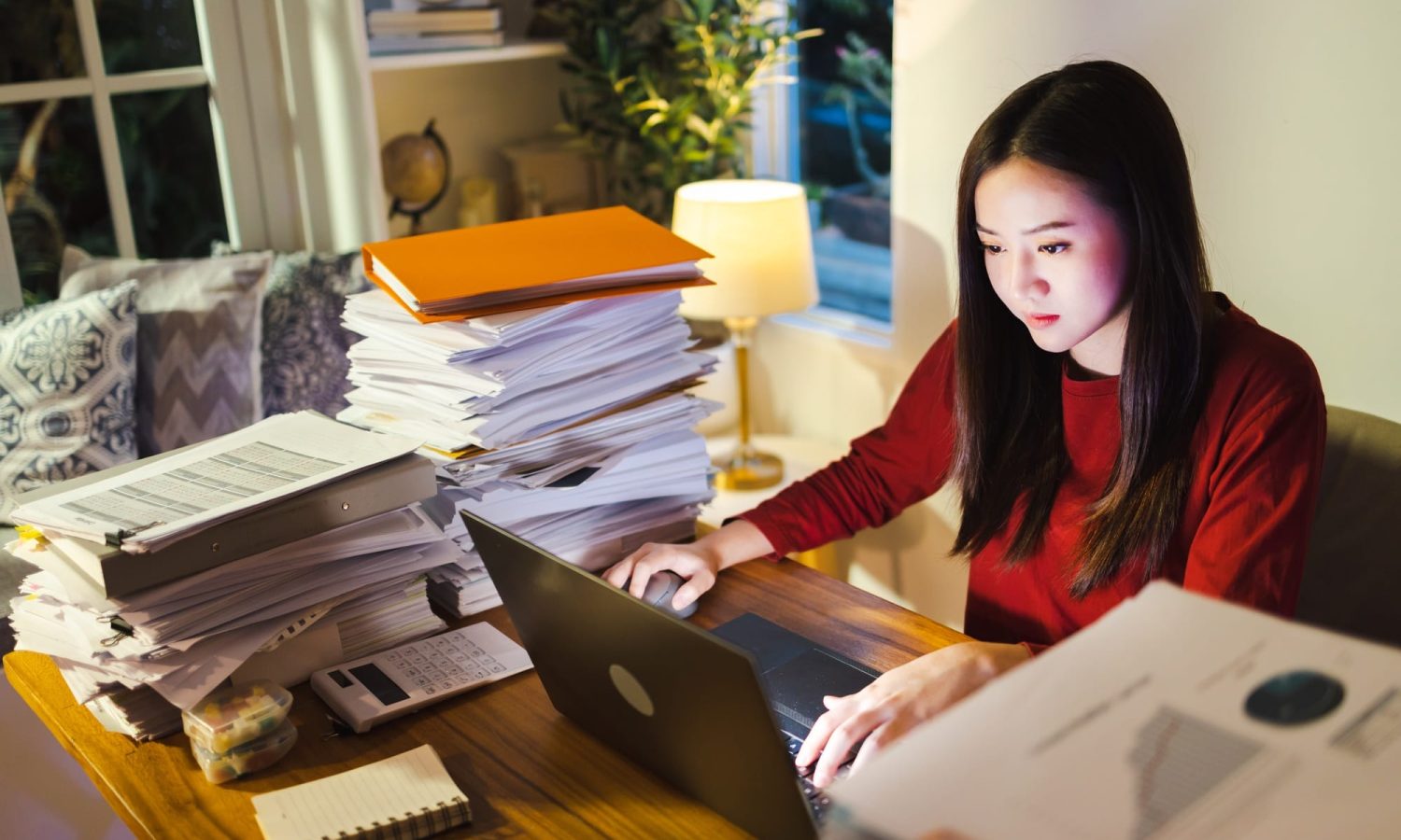 Stressed businesswoman on desk work overtime doing deadline project, late time business.