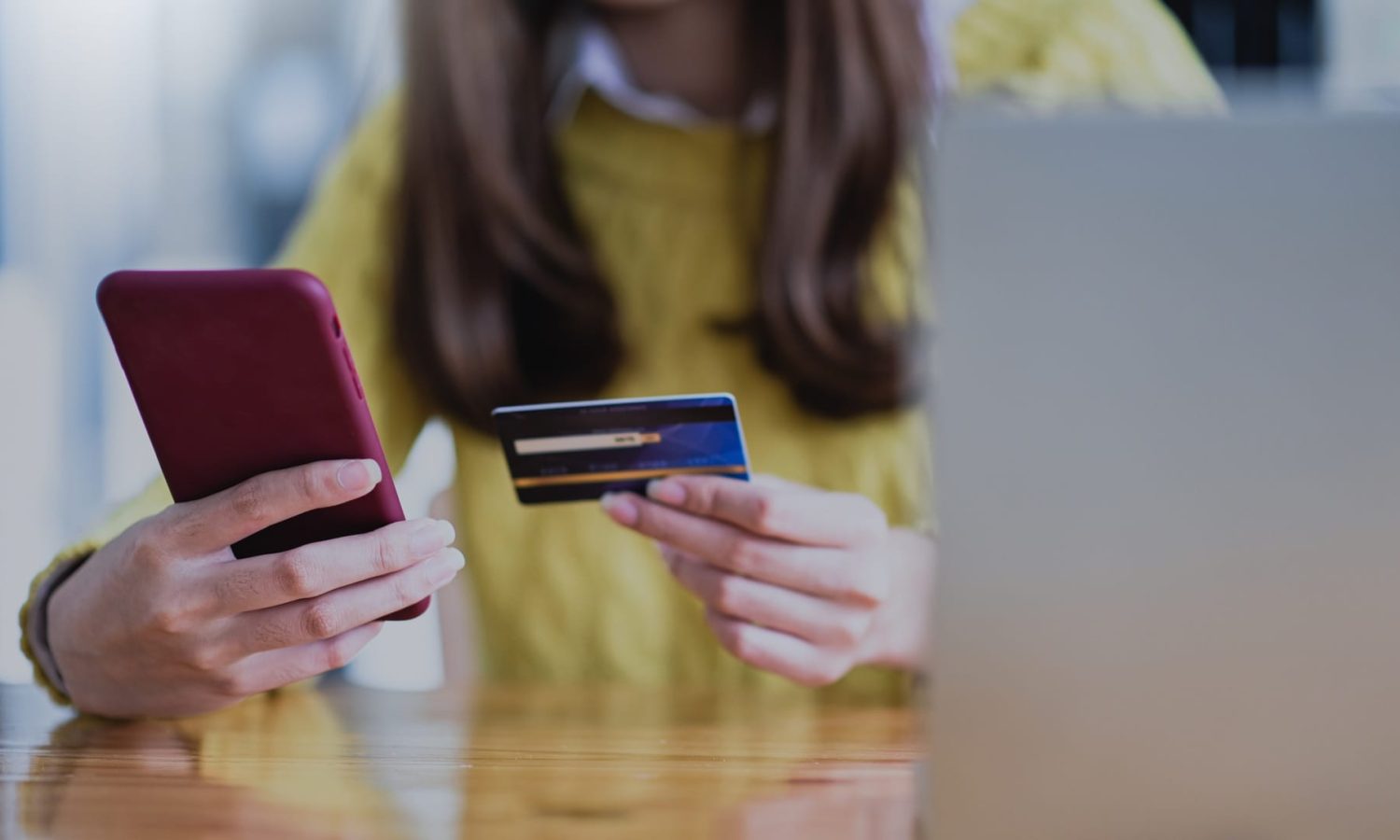 Young woman paying online by smartphone and credit card, Online shopping, Online banking.